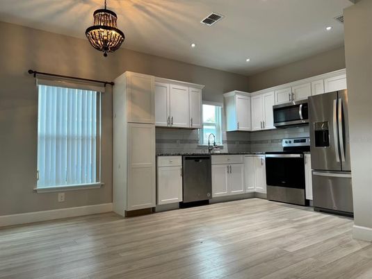 Interior, Kitchen, Pendant Lights, Recessed Lighting, Stainless Steel Appliances, Wood Texture Flooring