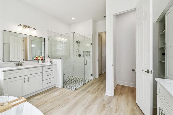 Bathroom, Dual Sink Vanities, Glass Shower, Interior, Recessed Lighting, Wood Texture Flooring