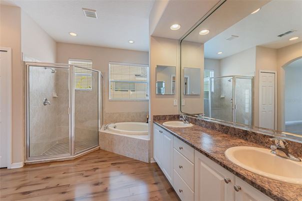 Bathroom, Dual Sink Vanities, Glass Shower, Interior, Recessed Lighting, Wood Texture Flooring