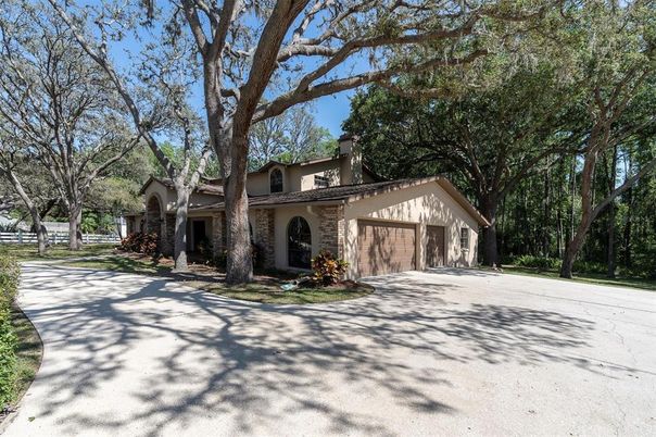 Attached, Backyard, Exterior, Facade, Brick Facade, Spanish Mediterranean