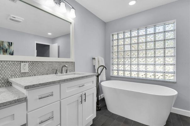 Bathroom, Dual Sink Vanities, Free Standing Baths, Interior, Recessed Lighting, Wood Texture Flooring