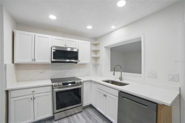 Interior, Kitchen, Recessed Lighting, Stainless Steel Appliances, Wood Texture Flooring