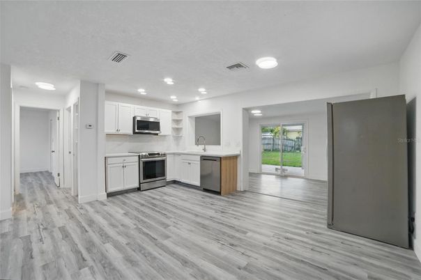 Interior, Kitchen, Recessed Lighting, Stainless Steel Appliances, Wood Texture Flooring