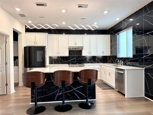 Interior, Kitchen, Marble Walls, Pendant Lights, Recessed Lighting, Stainless Steel Appliances, Wood Texture Flooring