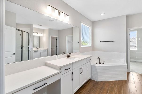 Bathroom, Dual Sink Vanities, Glass Shower, Interior, Recessed Lighting, Wood Texture Flooring