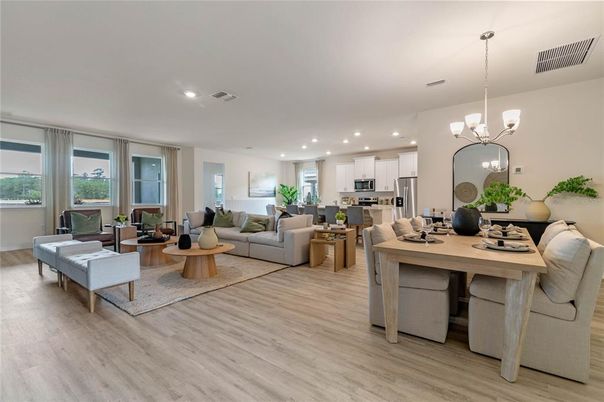 Chandelier, Dining room, Interior, Kitchen, Living room, Pendant Lights, Recessed Lighting, Stainless Steel Appliances, Wood Texture Flooring