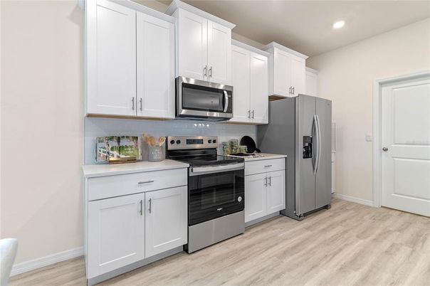 Interior, Kitchen, Recessed Lighting, Stainless Steel Appliances, Wood Texture Flooring
