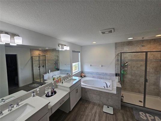 Bathroom, Dual Sink Vanities, Glass Shower, Interior, Recessed Lighting, Wood Texture Flooring