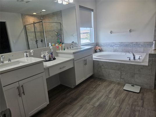 Bathroom, Dual Sink Vanities, Glass Shower, Interior, Recessed Lighting, Wood Texture Flooring