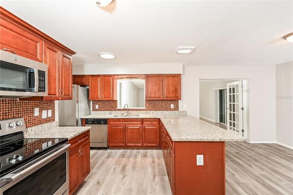 Interior, Kitchen, Recessed Lighting, Stainless Steel Appliances, Wood Texture Flooring