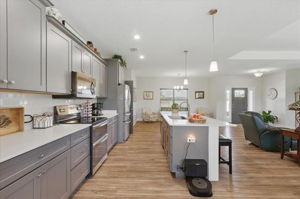 Dining room, Interior, Kitchen, Pendant Lights, Recessed Lighting, Stainless Steel Appliances, Wood Texture Flooring