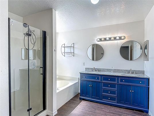 Bathroom, Dual Sink Vanities, Glass Shower, Interior, Wood Texture Flooring