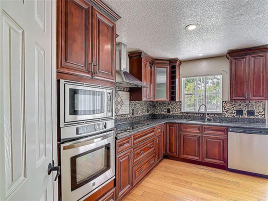 Interior, Kitchen, Recessed Lighting, Stainless Steel Appliances, Wood Texture Flooring
