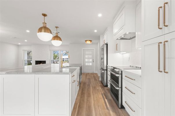 Fireplace, Interior, Kitchen, Pendant Lights, Recessed Lighting, Stainless Steel Appliances, Wood Texture Flooring