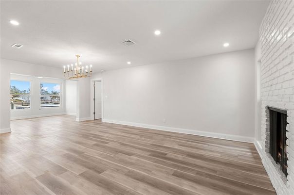Chandelier, Empty room, Fireplace, Interior, Recessed Lighting, Wood Texture Flooring