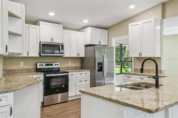 Interior, Kitchen, Recessed Lighting, Stainless Steel Appliances, Wood Texture Flooring