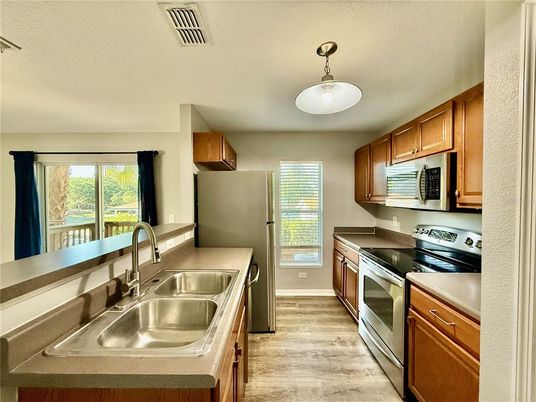 Interior, Kitchen, Pendant Lights, Stainless Steel Appliances, Wood Texture Flooring