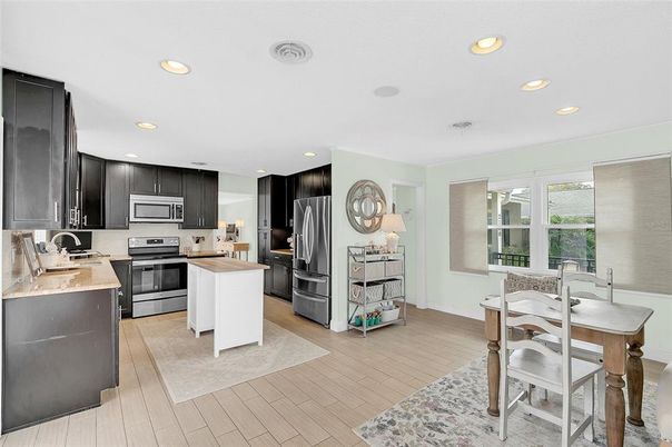 Dining room, Interior, Kitchen, Recessed Lighting, Stainless Steel Appliances, Wood Texture Flooring