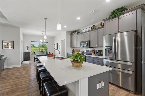 Dining room, Interior, Kitchen, Pendant Lights, Recessed Lighting, Stainless Steel Appliances, Wood Texture Flooring