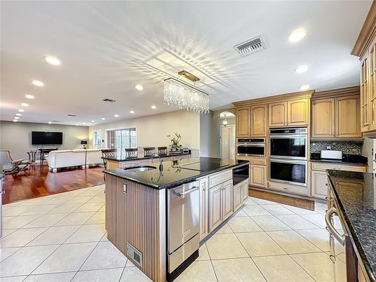Chandelier, Dining room, Interior, Kitchen, Living room, Recessed Lighting, Stainless Steel Appliances, Wood Texture Flooring