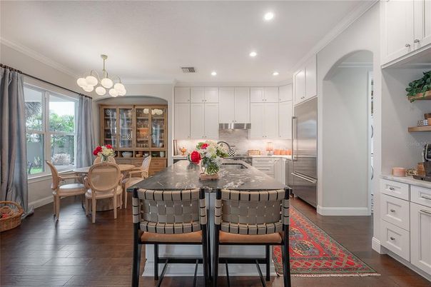 Chandelier, Dining room, Interior, Kitchen, Recessed Lighting, Stainless Steel Appliances, Wood Texture Flooring