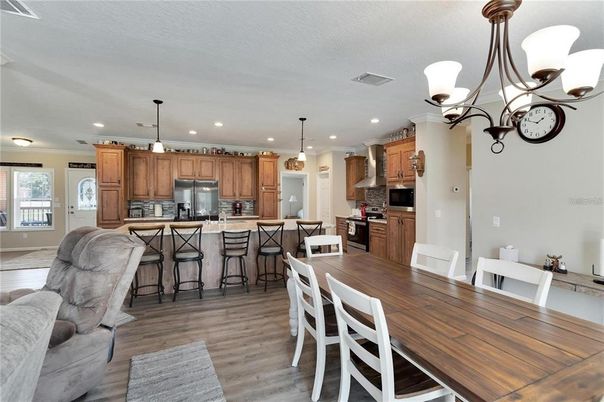 Dining room, Interior, Kitchen, Pendant Lights, Recessed Lighting, Stainless Steel Appliances, Wood Texture Flooring