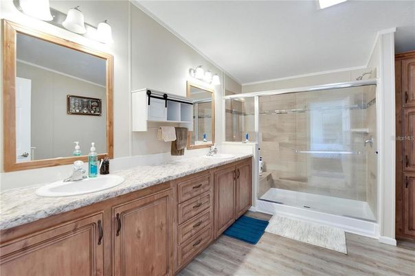 Bathroom, Dual Sink Vanities, Glass Shower, Interior, Wood Texture Flooring