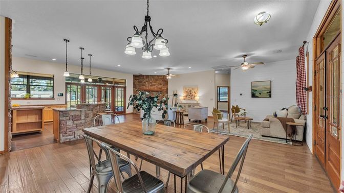 Chandelier, Dining room, Interior, Kitchen, Living room, Pendant Lights, Recessed Lighting, Stone Walls, Wood Texture Flooring