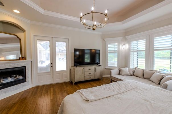 Bedroom, Chandelier, Fireplace, Interior, Recessed Lighting, Wood Texture Flooring