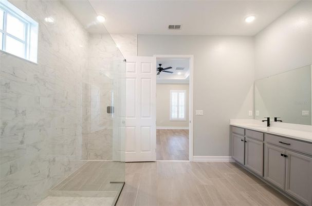 Bathroom, Glass Shower, Interior, Marble Walls, Recessed Lighting, Wood Texture Flooring