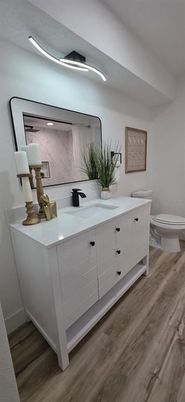 Bathroom, Dual Sink Vanities, Interior, Marble Walls, Wood Texture Flooring