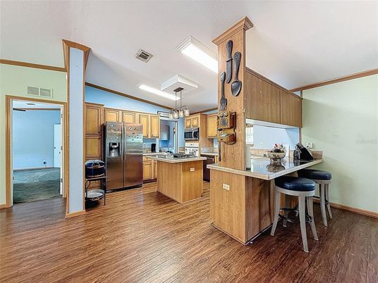 Chandelier, Interior, Kitchen, Recessed Lighting, Stainless Steel Appliances, Wood Texture Flooring