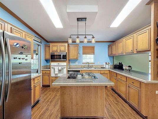 Interior, Kitchen, Pendant Lights, Tile Countertops, Wood Texture Flooring
