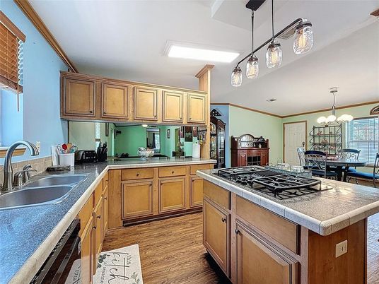 Chandelier, Dining room, Interior, Kitchen, Pendant Lights, Tile Countertops, Wood Texture Flooring