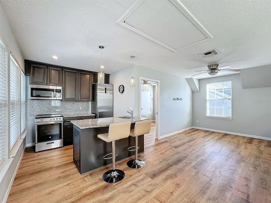 Interior, Kitchen, Pendant Lights, Recessed Lighting, Stainless Steel Appliances, Wood Texture Flooring