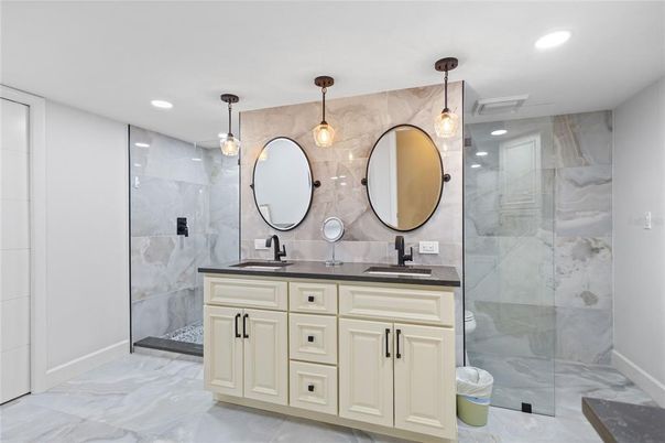 Bathroom, Dual Sink Vanities, Glass Shower, Interior, Marble, Marble Walls, Pendant Lights, Recessed Lighting