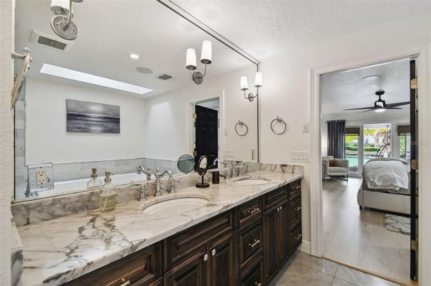 Bathroom, Dual Sink Vanities, Interior, Recessed Lighting, Wood Texture Flooring