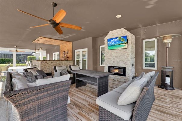 Dining room, Fireplace, Interior, Living room, Recessed Lighting, Wood Texture Flooring
