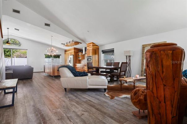 Dining room, Interior, Kitchen, Living room, Pendant Lights, Stainless Steel Appliances, Wood Texture Flooring