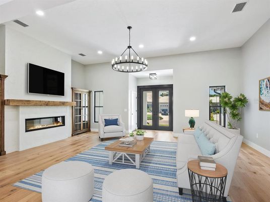 Chandelier, Fireplace, Interior, Living room, Pendant Lights, Recessed Lighting, Wood Texture Flooring