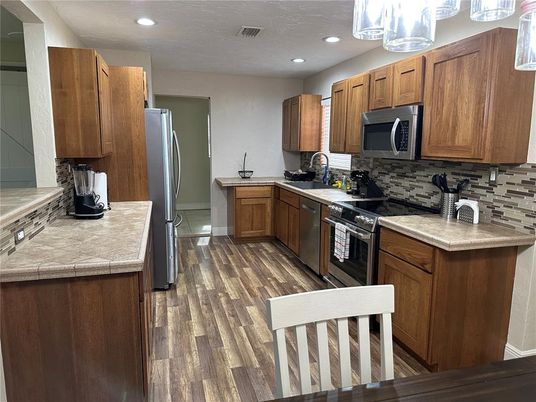 Interior, Kitchen, Recessed Lighting, Tile Countertops, Wood Texture Flooring