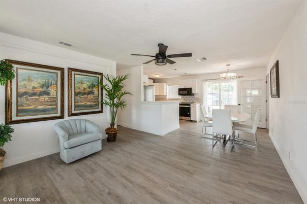 Chandelier, Dining room, Interior, Kitchen, Pendant Lights, Recessed Lighting, Stainless Steel Appliances, Wood Texture Flooring
