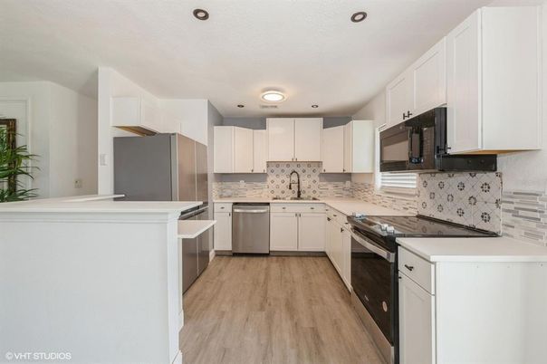 Interior, Kitchen, Recessed Lighting, Stainless Steel Appliances, Wood Texture Flooring