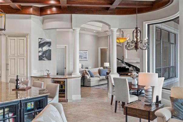 Chandelier, Dining room, Interior, Living room, Pendant Lights, Piano, Recessed Lighting, Wooden Beams