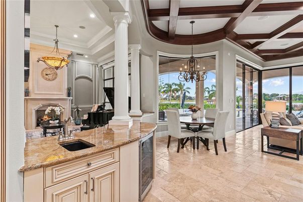 Chandelier, Dining room, Fireplace, Interior, Pendant Lights, Piano, Recessed Lighting, Wooden Beams