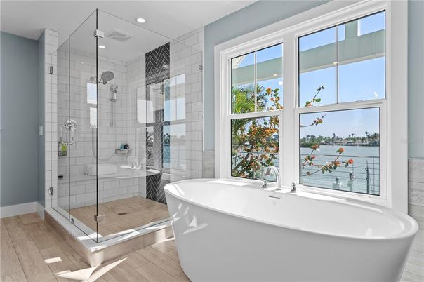 Bathroom, Free Standing Baths, Glass Shower, Interior, Recessed Lighting, Wood Texture Flooring