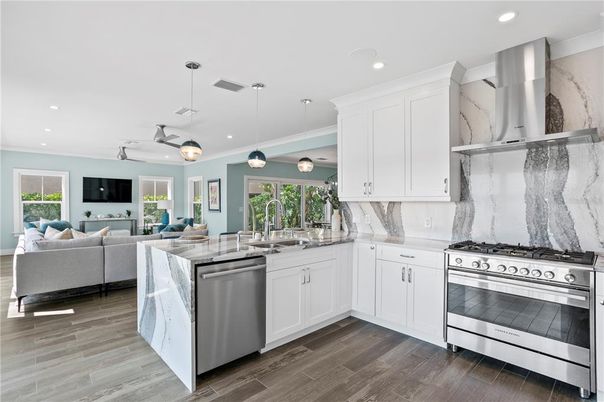 Interior, Kitchen, Living room, Marble Walls, Pendant Lights, Recessed Lighting, Stainless Steel Appliances, Wood Texture Flooring