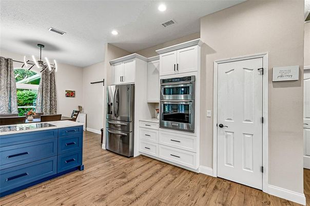 Dining room, Interior, Kitchen, Recessed Lighting, Stainless Steel Appliances, Wood Texture Flooring