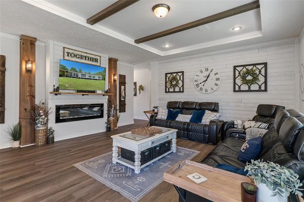 Fireplace, Interior, Living room, Recessed Lighting, Stone Walls, Wood Texture Flooring