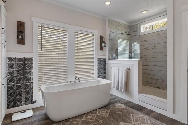 Bathroom, Free Standing Baths, Glass Shower, Interior, Recessed Lighting, Wood Texture Flooring